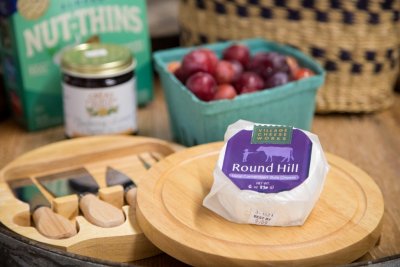 Round Hill Cheese from Village Cheeseworks pictured with fresh cherries from Great Country Farm