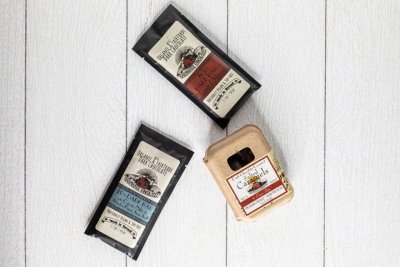 3 different bars of Farmhouse Chocolates on display on a white background in the farm market at Great Country Farms